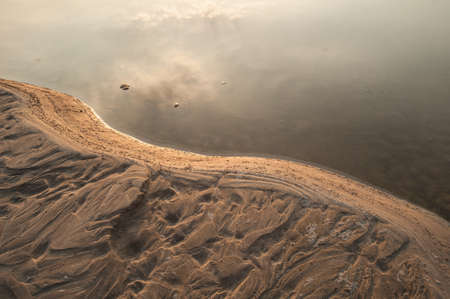 Sand dunes of Khong river and water plant.の写真素材