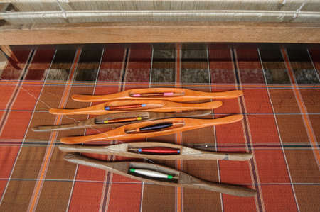 People are silk weaving in Thailandの写真素材