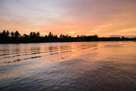 very beautiful and colorful sunrise over the riverの写真素材
