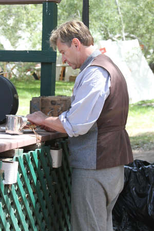 Civil War Reenactment; people talking, chatting, eating