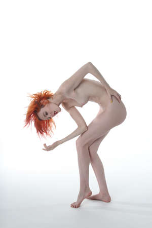 Photoshoot of a nude red headの写真素材