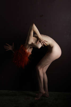 Photoshoot of a nude red headの写真素材