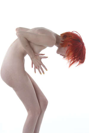 Photoshoot of a nude red headの写真素材