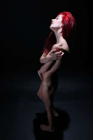 Photoshoot of a redhead in studioの写真素材