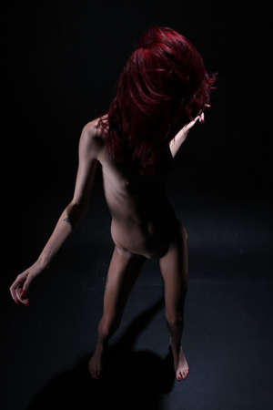 Photoshoot of a redhead in studioの写真素材