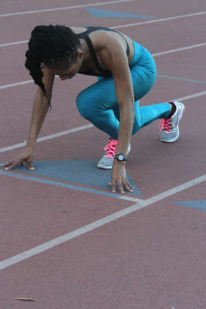 Athlete in Action on a track and fieldの写真素材