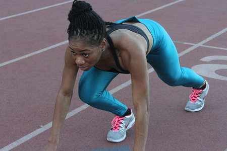 Athlete in Action on a track and fieldの写真素材