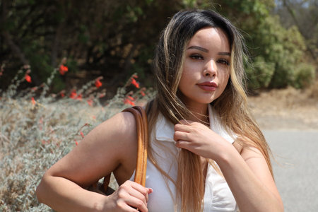 Photo of beautiful lady in a park on a summer dayの写真素材