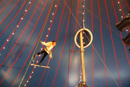 8-10-2022: Redwood city, California: Zoppe circus in Redwood city California, man on trapezeのeditorial素材
