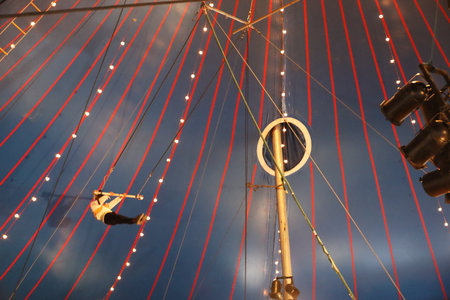 8-10-2022: Redwood city, California: Zoppe circus in Redwood city California, man on trapezeのeditorial素材