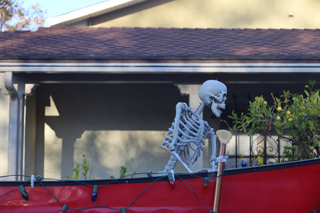 11-1-2022: Burlingame, California: Halloween decorations on streets, Skeleton in a row boatのeditorial素材