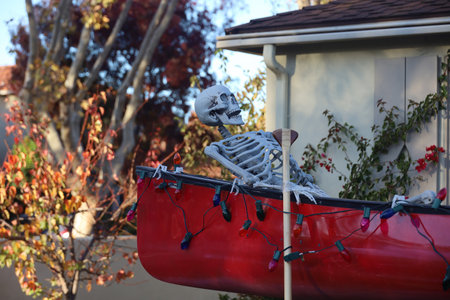 11-1-2022: Burlingame, California: Halloween decorations on streets, Skeleton in a row boatのeditorial素材