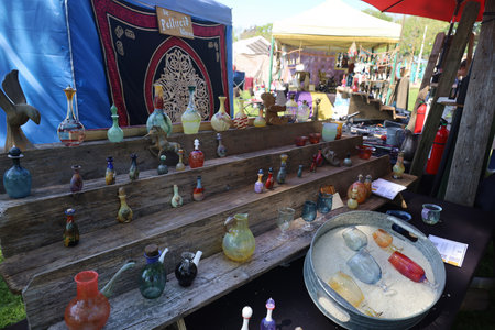 4-15-2023: Visalia, California: Artwork and vendors in period costumes at a Renaissance Faireのeditorial素材