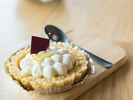 Pie in wooden plate.
