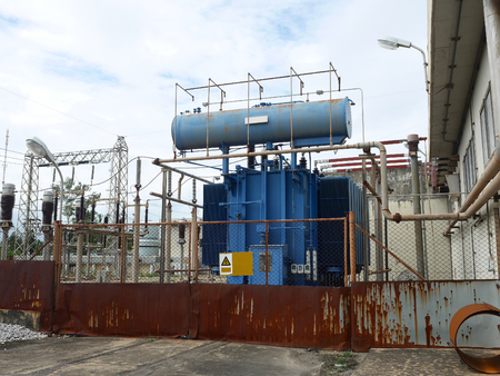 Old transformer in electrical substation.