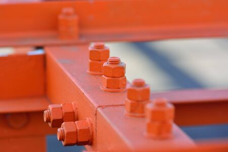 close up on the bolts and nuts on the industrail equipment
