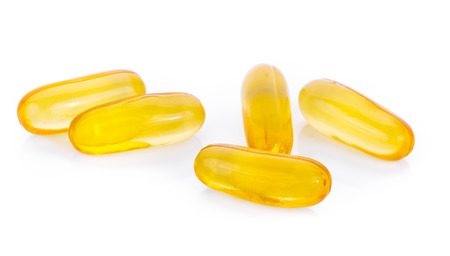 fish oil capsules isolated on a white backgroundの写真素材