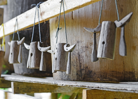 old wooden cowbell hanging on the wall, traditional Thailand cowbellsの写真素材