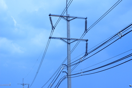 Electric pole with sky as backgroundの写真素材