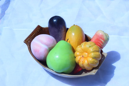 Artificial fruit, bright colors on the background white.の写真素材