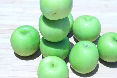 Green apple and half with seeds Green appleの写真素材