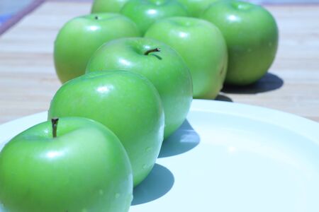 Green apple and half with seeds Green appleの写真素材