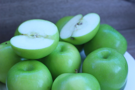 Green apple and half with seeds Green appleの写真素材