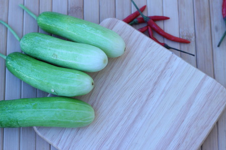 Fresh vegetables placed together on a brown backgroundの写真素材