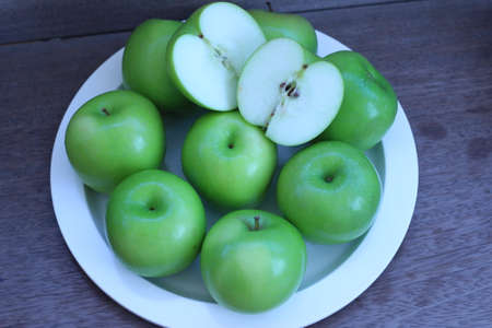 Green apple and half with seeds Green appleの写真素材