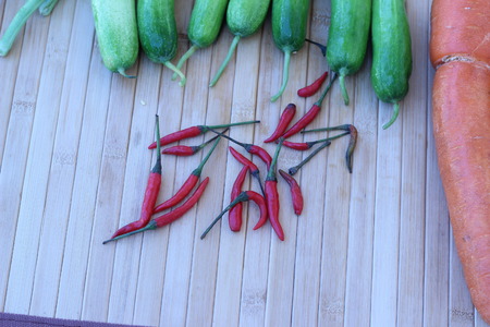Fresh vegetables placed together on a brown backgroundの写真素材