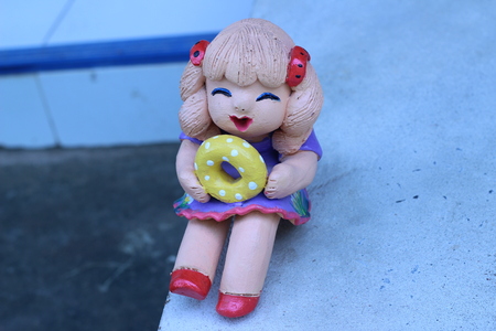 Dolls are happy for a beautiful gardenの写真素材