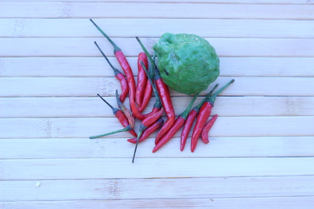 Fresh vegetables placed together on a brown backgroundの写真素材