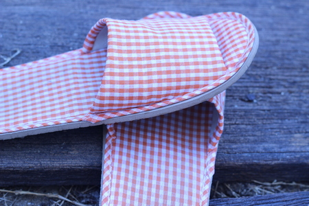 Shoes in the house on a wooden board in the gardenの写真素材