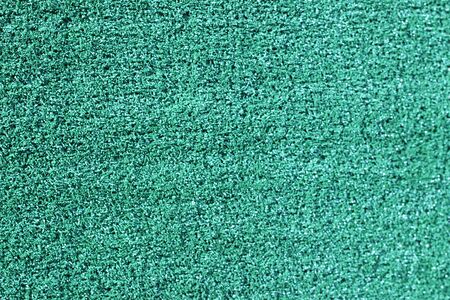 Artificial grass is rough, beautiful green backgroundの写真素材