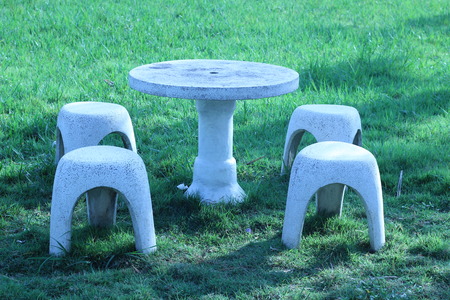 Bench white marble spheres in the grassの写真素材