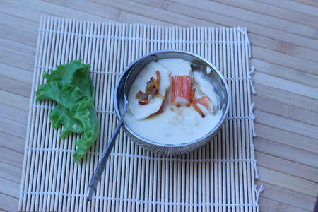 Mix crab meat, poached egg in a cup of delicious foodの写真素材