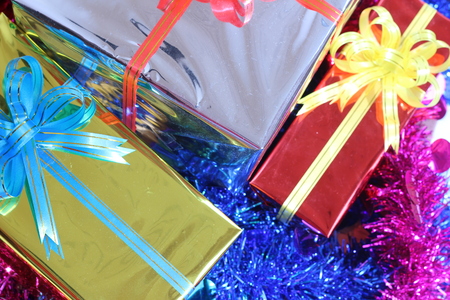 Gift box of multi-colored ribbons arranged beautifullyの写真素材