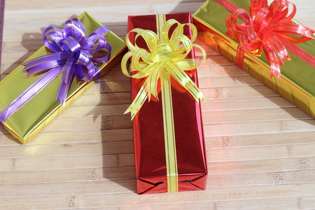 Gift box of multi-colored ribbons arranged beautifullyの写真素材