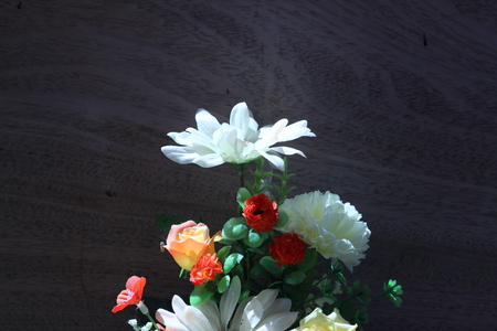 Flowers in a vase on a wooden table old beautiful grayの写真素材