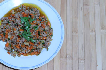 Fried pork chops with carrots, onion, celery and garlic (Thailand Food)の写真素材