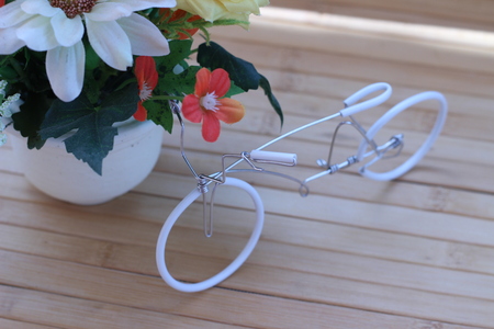 Beautiful flowers in a vase on a wooden brown backgroundの写真素材