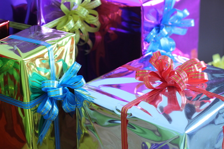 Gift box of multi-colored ribbons arranged beautifullyの写真素材