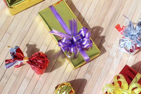 Gift box of multi-colored ribbons arranged beautifullyの写真素材