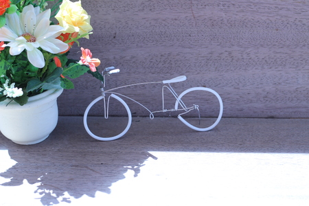 Flowers in a vase on a wooden table old beautiful grayの写真素材