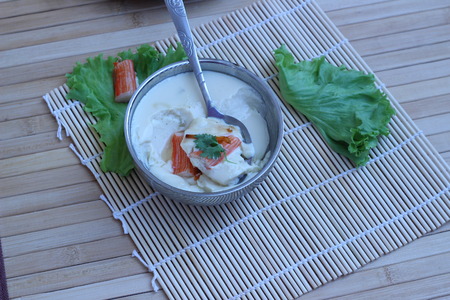 Mix crab meat, poached egg in a cup of delicious foodの写真素材