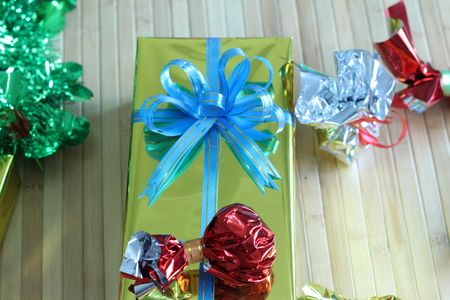 Gift box of multi-colored ribbons arranged beautifullyの写真素材