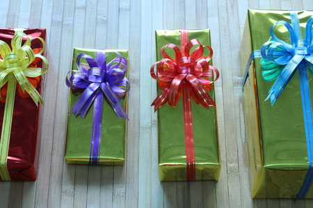 Gift box of multi-colored ribbons arranged beautifullyの写真素材