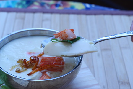 Mix crab meat, poached egg in a cup of delicious foodの写真素材