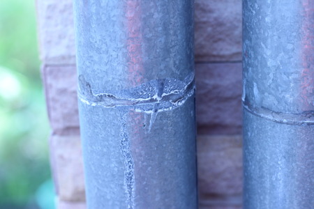 Rain gutters are attached to the roof and exterior wallsの写真素材