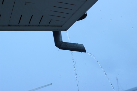 Gutter next to the houseの写真素材